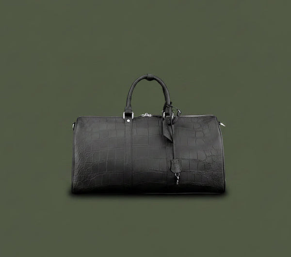 Black leather duffel bag on a dark green background