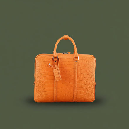 Load image into Gallery viewer, Orange textured briefcase on a dark green background