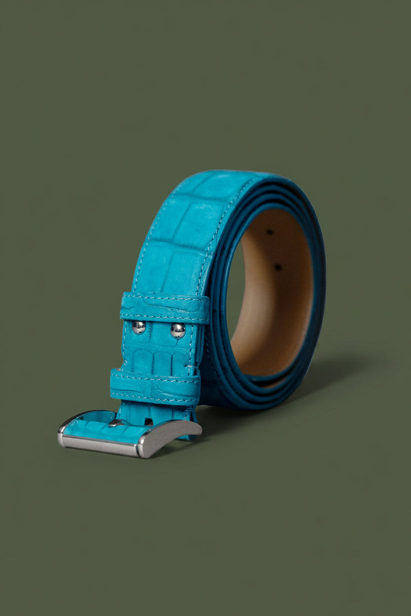 Turquoise leather belt with silver buckle on a white background